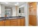 Bathroom with double sinks, granite countertop, and shower at 3743 Albacete Cir # 84, Punta Gorda, FL 33950