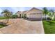 Home exterior with stamped concrete driveway and landscaping at 7417 S Blue Sage, Punta Gorda, FL 33955
