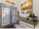 Bright entryway with decorative console table and double doors at 7417 S Blue Sage, Punta Gorda, FL 33955