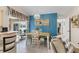 Bright dining area with a rustic table and chairs, near sliding doors to a patio at 7417 S Blue Sage, Punta Gorda, FL 33955