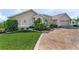 Landscaped front yard with stamped concrete driveway at 7417 S Blue Sage, Punta Gorda, FL 33955