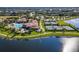 Community pool and tennis courts with lakefront views and walking trails at 20149 Lagente Cir, Venice, FL 34293