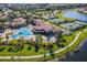 Community pool and tennis courts with lush landscaping and walking paths at 20149 Lagente Cir, Venice, FL 34293