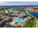 Community pool, tennis courts, and clubhouse with surrounding homes at 20149 Lagente Cir, Venice, FL 34293