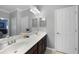 Double vanity bathroom with dark brown cabinets at 20149 Lagente Cir, Venice, FL 34293