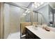 Bathroom with shower/tub combo, vanity, and mirror at 20149 Lagente Cir, Venice, FL 34293