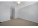 Bright bedroom featuring neutral walls, carpet flooring, and a ceiling fan at 20149 Lagente Cir, Venice, FL 34293