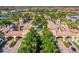 Grand entrance to a community with palm trees and Spanish-style architecture at 20149 Lagente Cir, Venice, FL 34293