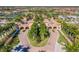 Grand entrance to a community with palm trees and Spanish-style architecture at 20149 Lagente Cir, Venice, FL 34293