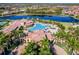Resort-style pool with large clubhouse and surrounding palm trees at 20149 Lagente Cir, Venice, FL 34293