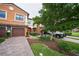 Two-story townhome with a two-car garage and landscaped yard at 20149 Lagente Cir, Venice, FL 34293
