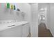 Convenient laundry room with washer, dryer, and shelving at 20149 Lagente Cir, Venice, FL 34293