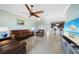 Spacious living room with leather furniture and large TV at 20149 Lagente Cir, Venice, FL 34293