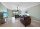 Living Room with leather furniture and sliding glass doors to lanai at 20149 Lagente Cir, Venice, FL 34293