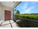 Screened patio with door access and view of landscaped grounds at 20149 Lagente Cir, Venice, FL 34293