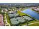 Six well-maintained tennis courts in a community setting with surrounding landscape at 20149 Lagente Cir, Venice, FL 34293