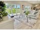 Bright living room with comfy sofa and coffee table, featuring sliding glass doors at 3140 Sweet Gum Dr, Punta Gorda, FL 33982