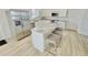 Modern kitchen featuring a large island with seating and stainless steel appliances at 3140 Sweet Gum Dr, Punta Gorda, FL 33982