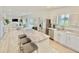 Modern kitchen with white cabinets, stainless steel appliances, and a large island at 3140 Sweet Gum Dr, Punta Gorda, FL 33982