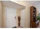 Interior condo entry with white door and closet at 19345 Water Oak Dr # 208, Port Charlotte, FL 33948