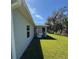 House exterior showcasing a screened patio and grassy yard at 4089 Appleton Ter, North Port, FL 34286