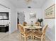 Bright dining area with glass table and four chairs at 3494 Yukon Dr, Port Charlotte, FL 33948