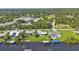 Aerial view of multiple waterfront homes with private docks and pools at 3494 Yukon Dr, Port Charlotte, FL 33948