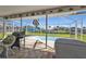 Enjoy the screened pool and spa from the patio at 3494 Yukon Dr, Port Charlotte, FL 33948