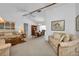 Spacious living and dining area with neutral decor and hardwood floors at 3494 Yukon Dr, Port Charlotte, FL 33948