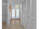 Bright and airy entryway with double doors and built-in storage at 3494 Yukon Dr, Port Charlotte, FL 33948