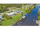 Drone view of canal-front property with private pool and dock at 3494 Yukon Dr, Port Charlotte, FL 33948