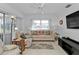Living room with comfortable seating and large windows at 3494 Yukon Dr, Port Charlotte, FL 33948