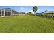 Large grassy backyard leading to waterfront at 3494 Yukon Dr, Port Charlotte, FL 33948