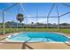 Refreshing, screened-in pool with steps for easy access at 3494 Yukon Dr, Port Charlotte, FL 33948