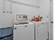 Laundry room with washer and dryer, and additional storage at 3494 Yukon Dr, Port Charlotte, FL 33948