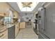 Open kitchen with granite countertops and stainless steel appliances at 3494 Yukon Dr, Port Charlotte, FL 33948