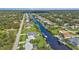Aerial view of waterfront homes with private docks and pools at 3494 Yukon Dr, Port Charlotte, FL 33948