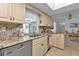 Kitchen with granite countertops and stainless steel appliances, open to dining at 3494 Yukon Dr, Port Charlotte, FL 33948