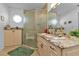 Updated bathroom with granite countertops, walk-in shower, and updated cabinetry at 3494 Yukon Dr, Port Charlotte, FL 33948