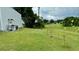 Spacious backyard with young lemon trees and grassy area at 3140 Sweet Gum Dr, Punta Gorda, FL 33982