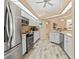 Spacious kitchen with stainless steel appliances and light wood flooring at 4077 La Costa Island Ct, Punta Gorda, FL 33950