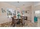 Dining room features a glass-top table and a view to the kitchen at 4077 La Costa Island Ct, Punta Gorda, FL 33950