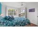 Bright bedroom with a comfortable bed and pool view at 4077 La Costa Island Ct, Punta Gorda, FL 33950