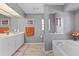 Spa-like bathroom with double vanity and light wood flooring at 4077 La Costa Island Ct, Punta Gorda, FL 33950