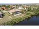 Aerial view showcasing home with pool and canal-front location at 4077 La Costa Island Ct, Punta Gorda, FL 33950