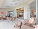 Relaxing screened patio with wicker furniture and access to the pool at 4077 La Costa Island Ct, Punta Gorda, FL 33950