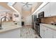 Modern kitchen with stainless steel appliances and ample counter space at 4077 La Costa Island Ct, Punta Gorda, FL 33950