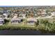 Aerial view of property showcasing home, pool, and waterfront lot at 4077 La Costa Island Ct, Punta Gorda, FL 33950