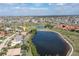 Aerial view of the house and surroundings, near golf course and lake at 4077 La Costa Island Ct, Punta Gorda, FL 33950