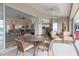 Enclosed patio with wicker furniture and view of living area at 4077 La Costa Island Ct, Punta Gorda, FL 33950